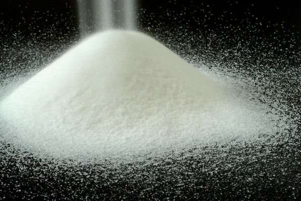 WHITE REFINED CANE SUGAR -  advertising new products polarization- 99, 80 % minimum--moisture- 00.04% maximum--sulphate ash content- 00.04% maximum  --granulation- medium to fine--solubility- 100% dry and free flowing--radiation- normal w/o presence of cesium or iodine,  certified--color- sparkling white. maximum,  45 icumsa--sediment- none--smell- free 